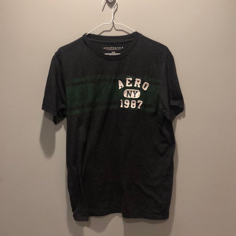 Men’s dark grey tee shirt with a green stripe